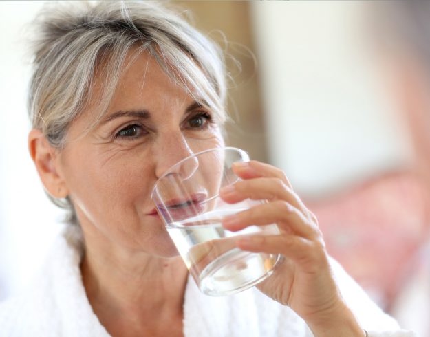 Woman drinking a glass of water